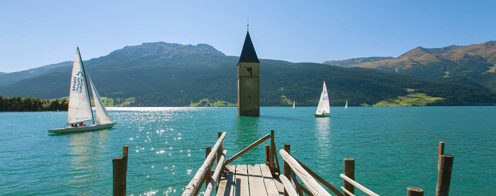 Bell Tower of Lake Resia - Resia | Secret World Trip Planner