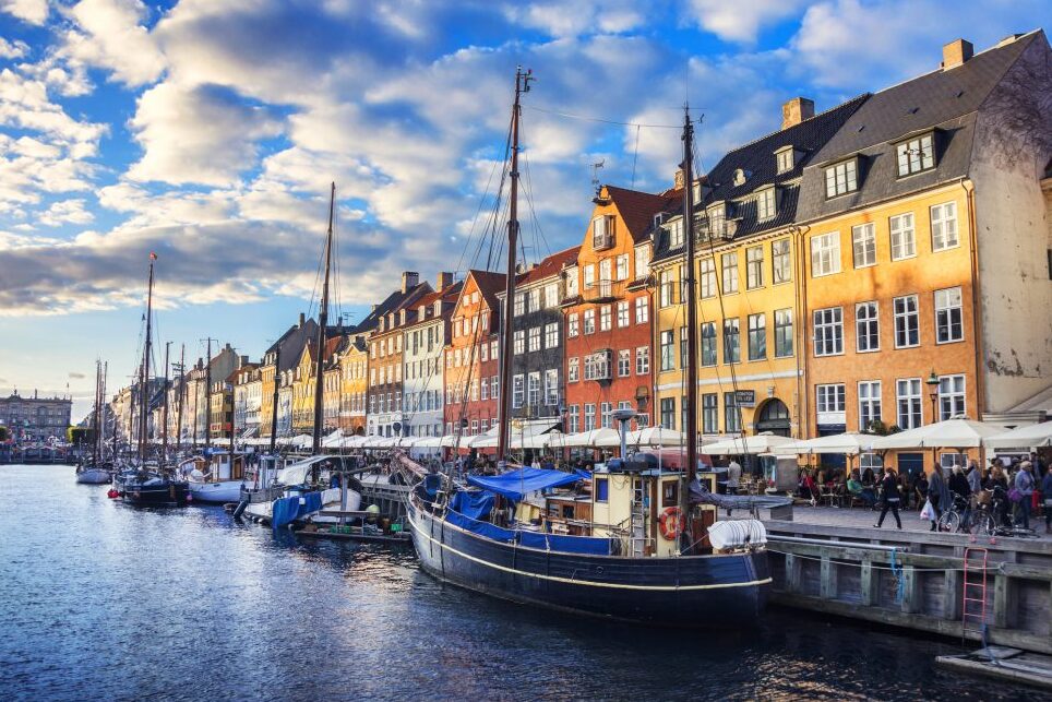 Nyhavn is a beautiful harbor district in Copenhagen - København | Secret World Trip Planner