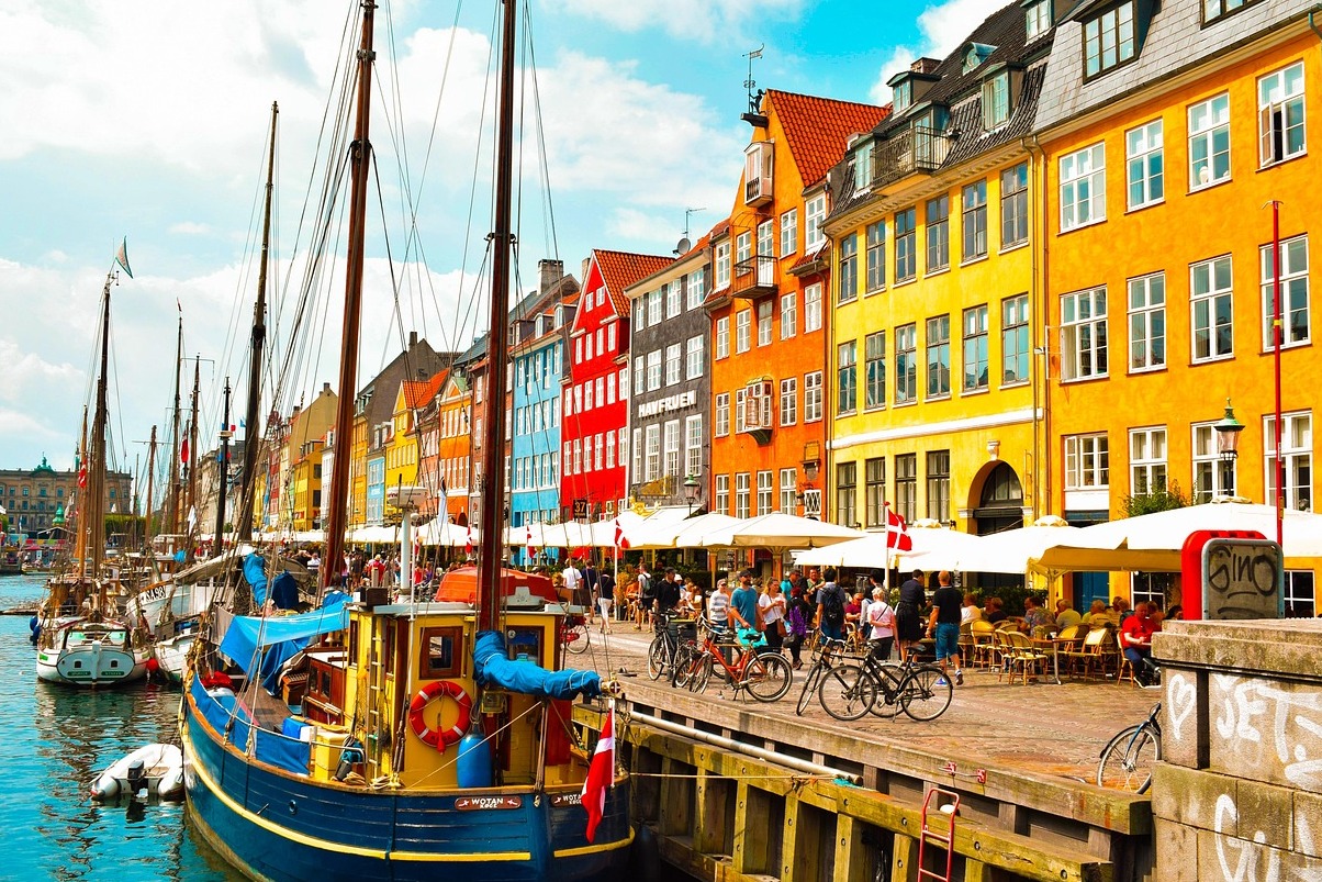 Nyhavn is a beautiful harbor district in Copenhagen - København | Secret World Trip Planner