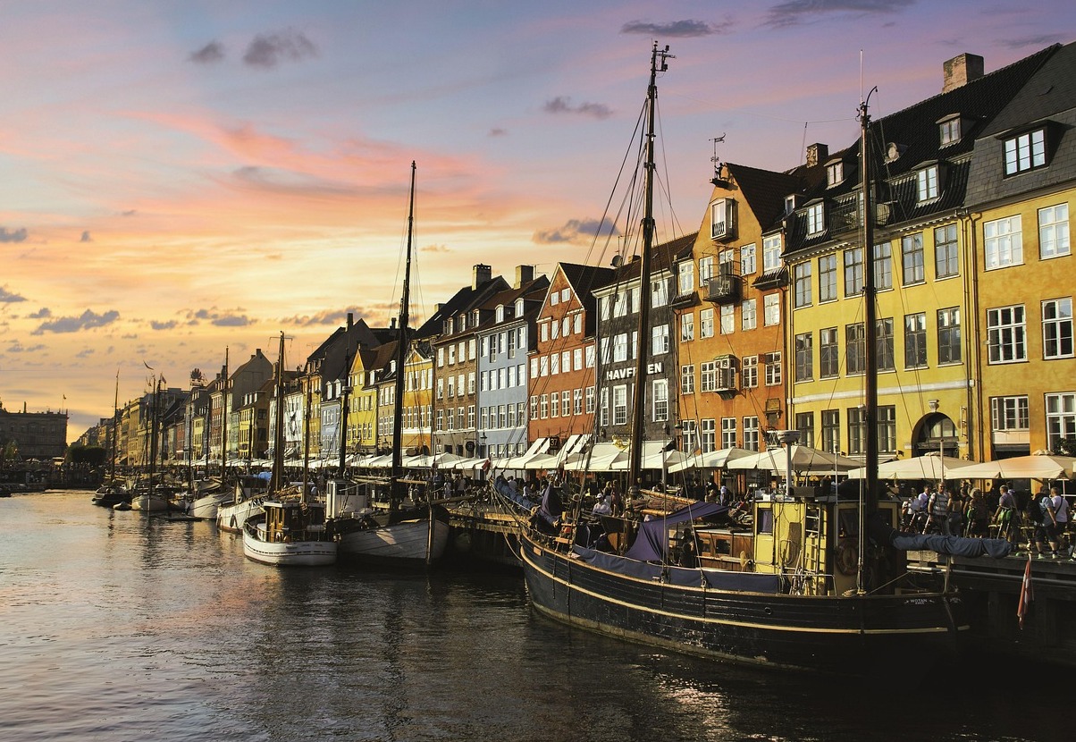 Nyhavn is a beautiful harbor district in Copenhagen - København | Secret World Trip Planner