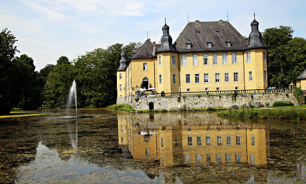 The imposing moated Schloss Dyck - Jüchen | Secret World Trip Planner